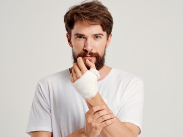 Man holding injured arm