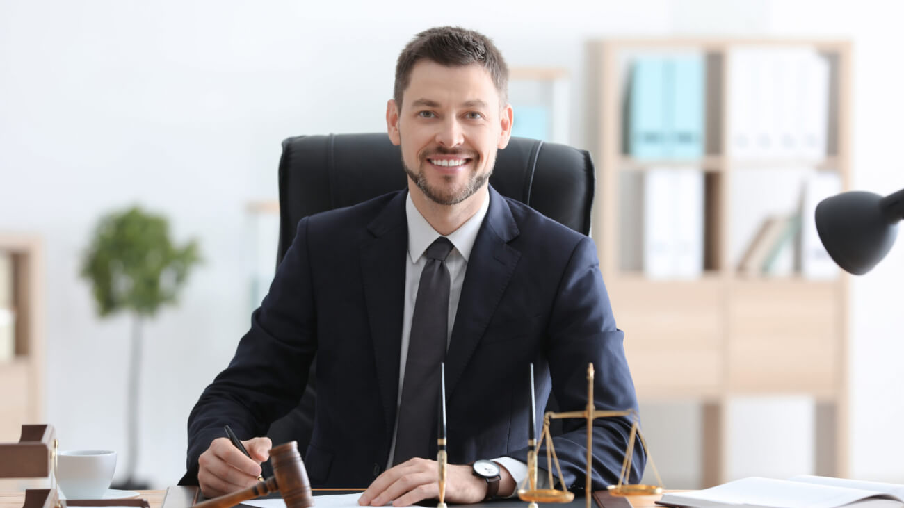 Young male notary working in office