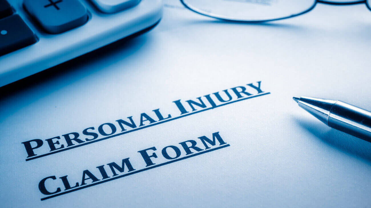 personal injury claim form on desk.